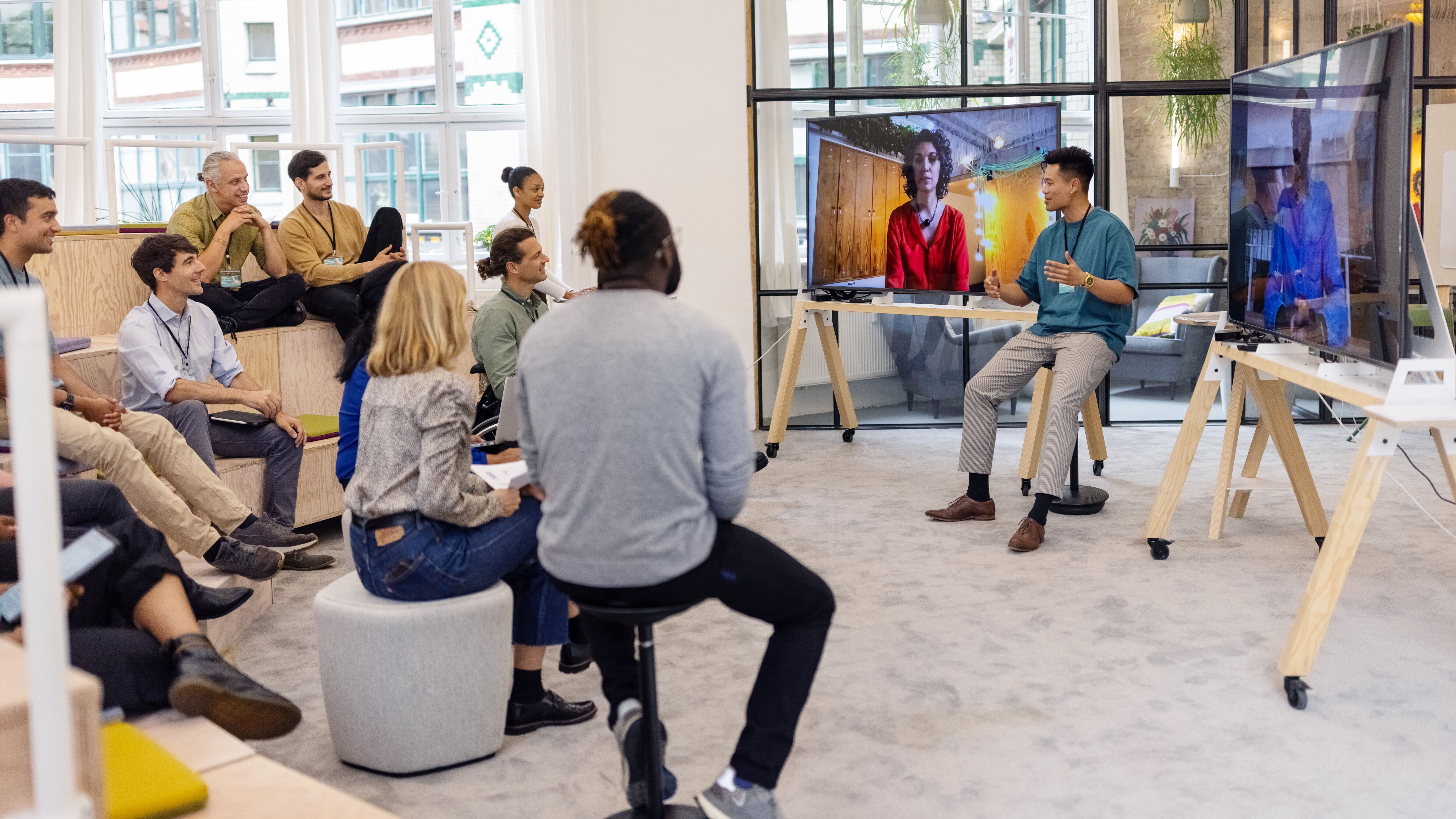 Employees gather for a team meeting in the office