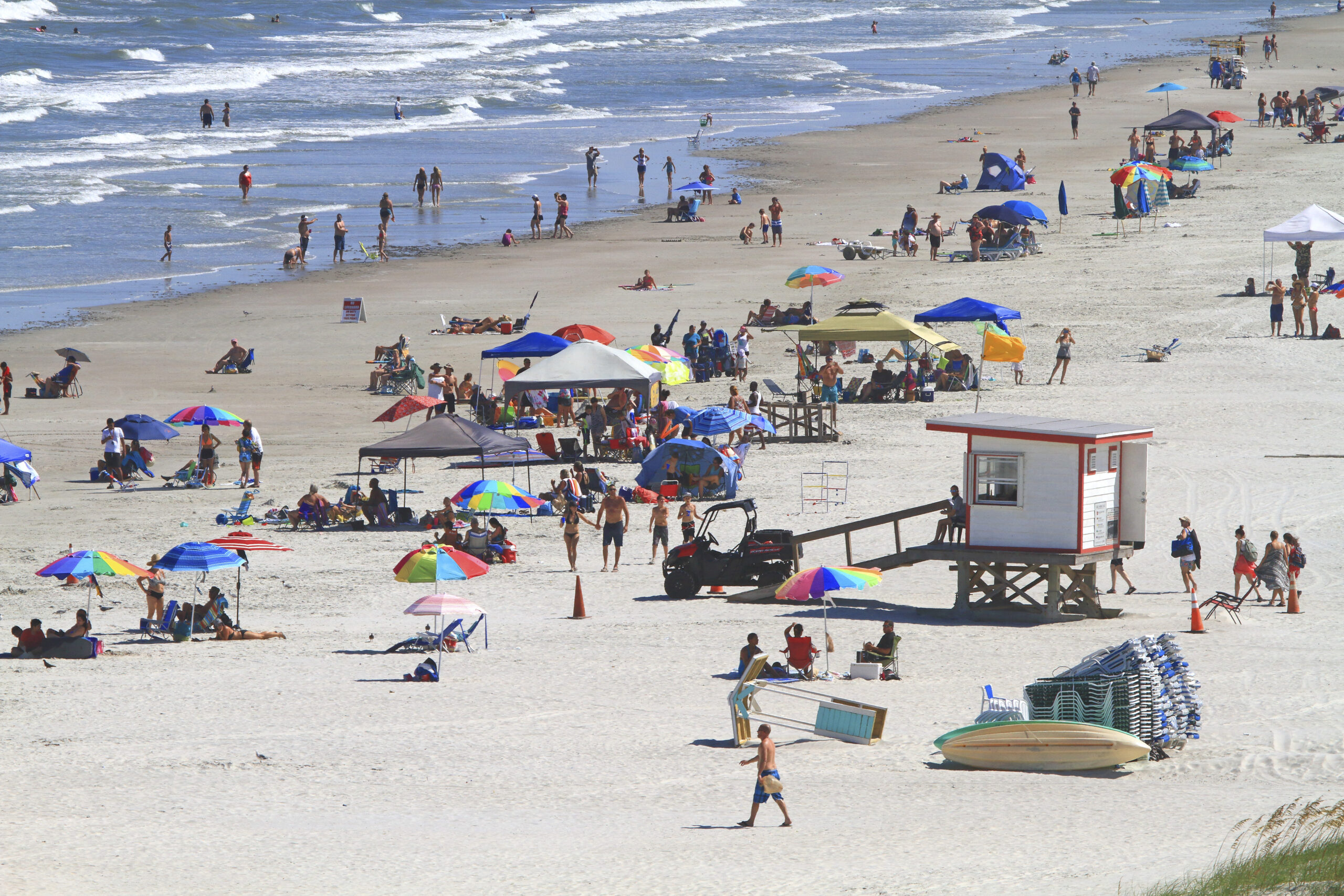 A beach crowded with beachgoers