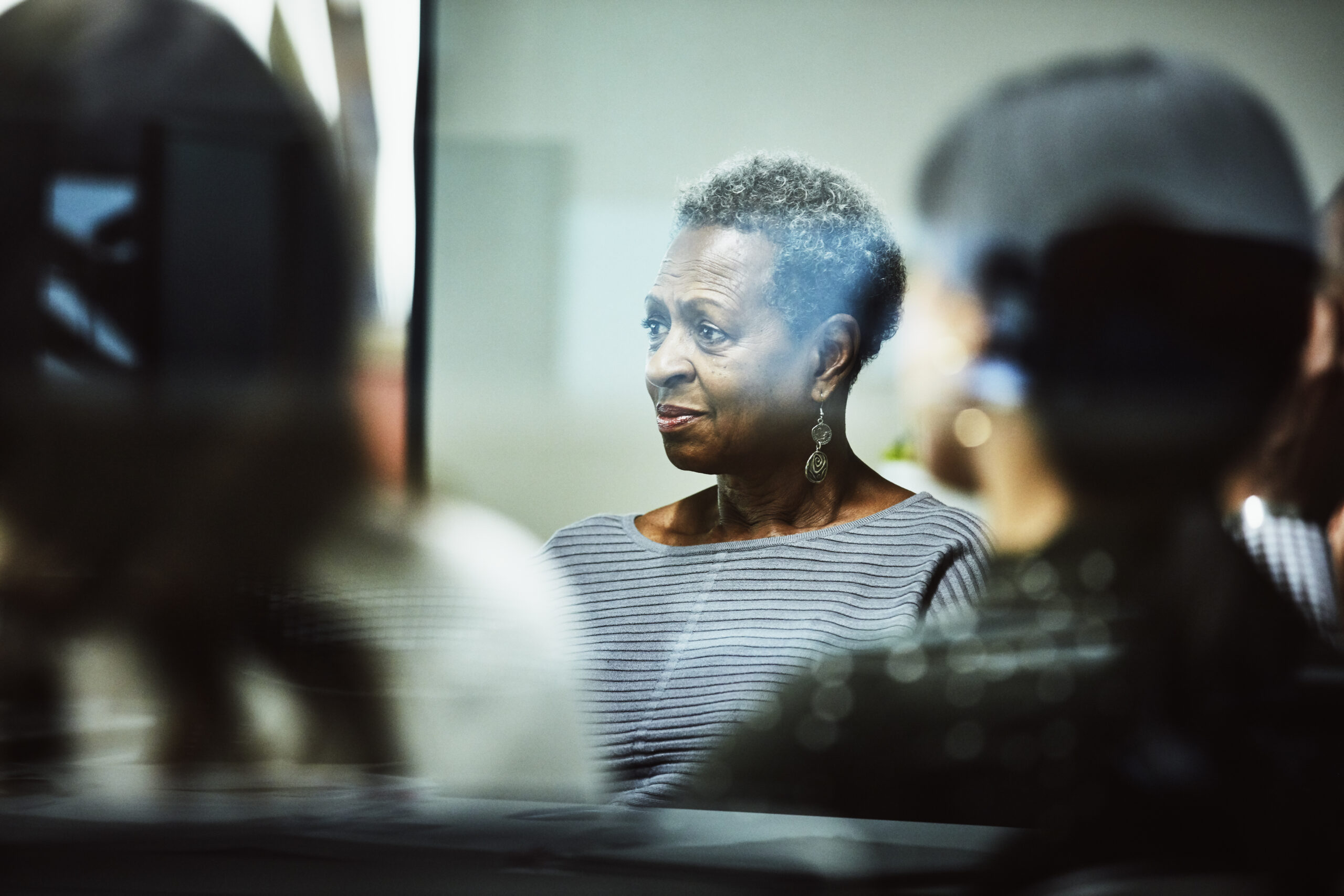 Businessperson listening to client presentation in conference room