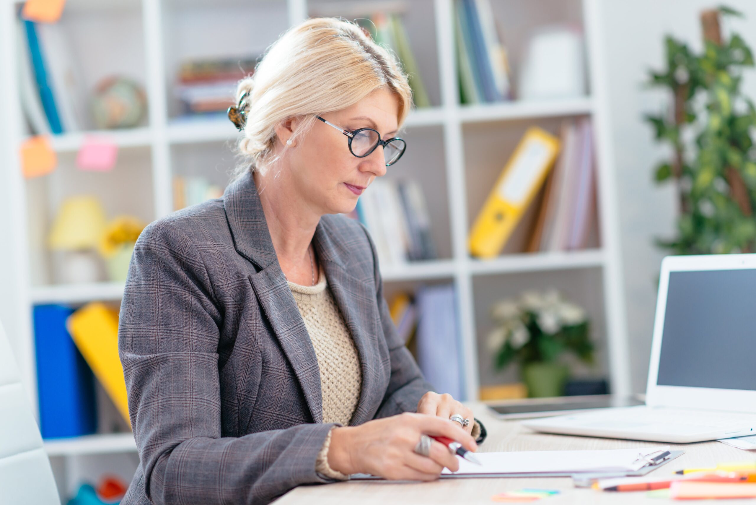 Finance executive looking at report in office