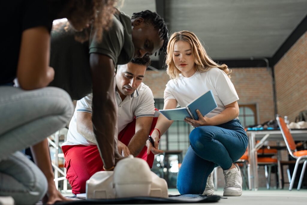 Group of people practicing CPR